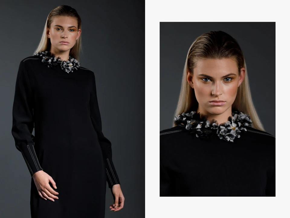 fashion portret van model in een zwarte jurk met een broderie d'art kraagje